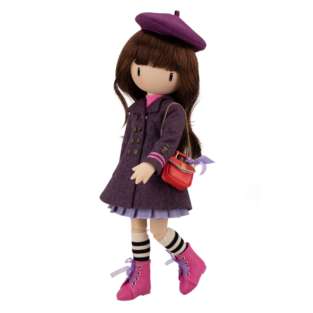 Doll wearing a purple coat, beret, and pink boots.
