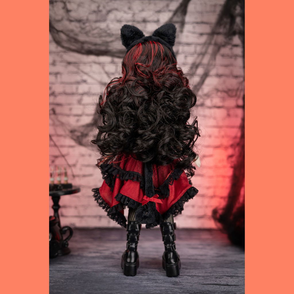 Halloween edition ruby red doll with black and red outfit and cat ears.