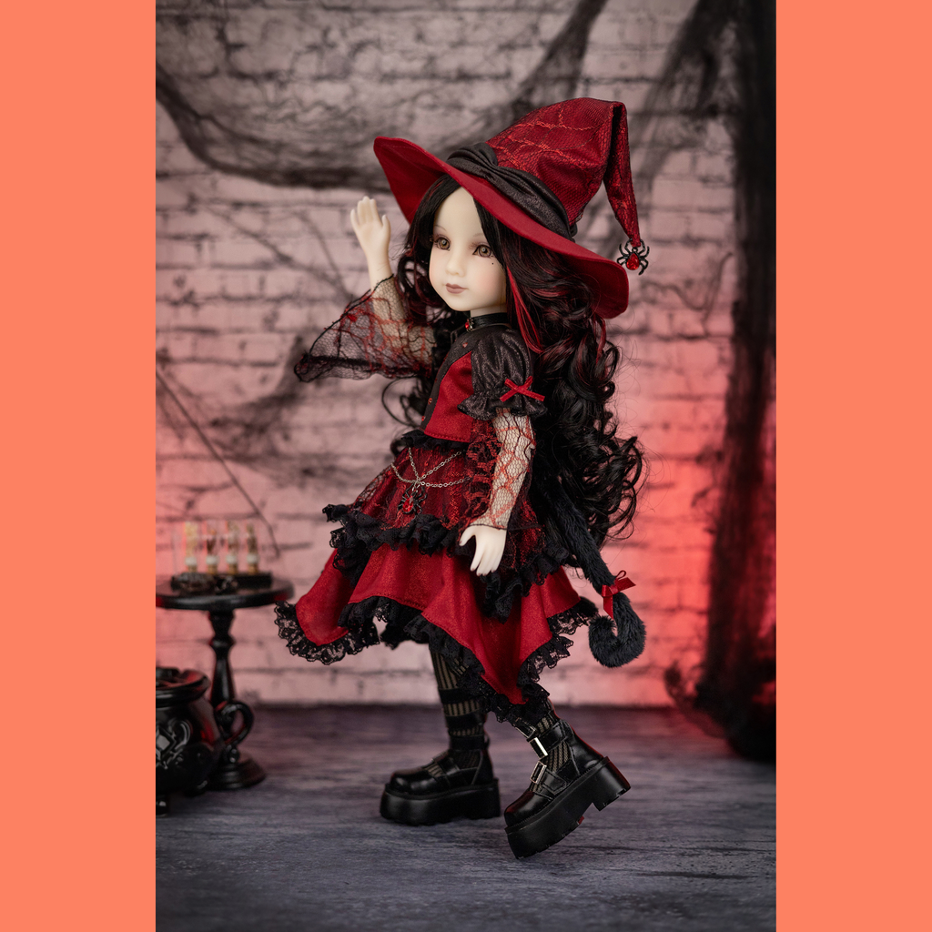 Gothic-style ruby red halloween doll in red and black cat costume.