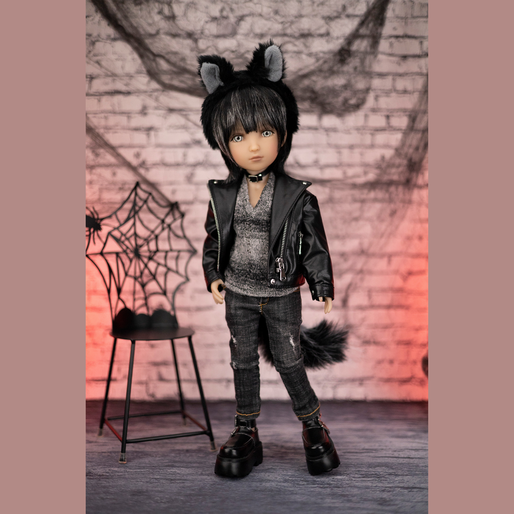 Ruby red halloween doll Kaiden wearing a black and grey outfit with cat ears and tail on a spinning table.