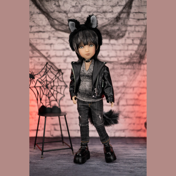 Ruby red halloween doll Kaiden wearing a black and grey outfit with cat ears and tail on a spinning table.