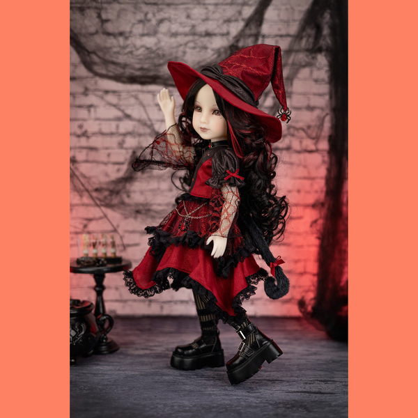 Halloween edition ruby red doll maxine in her gothic red and black cat costume on a spinning table.
