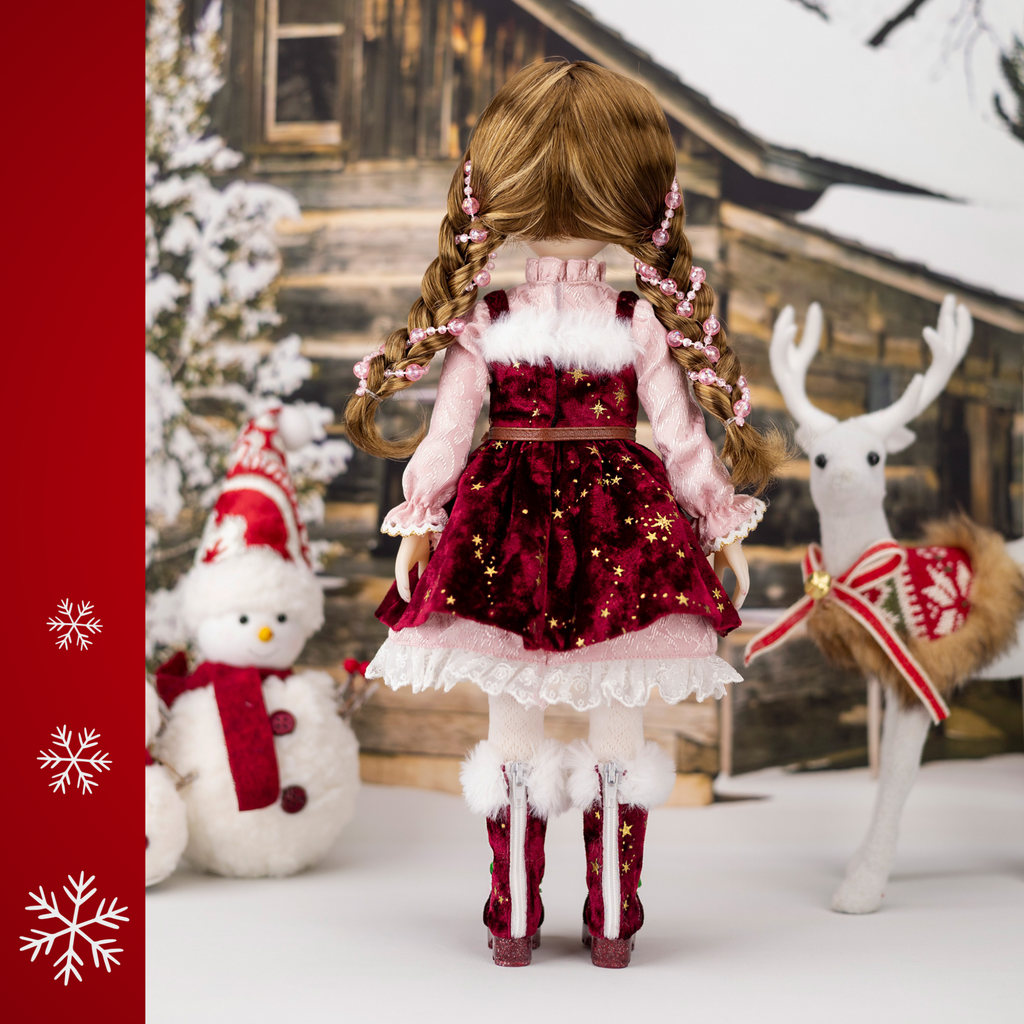 Ruby Red 2025 Holiday Edition Doll Angel in red and pink Christmas themed dress.