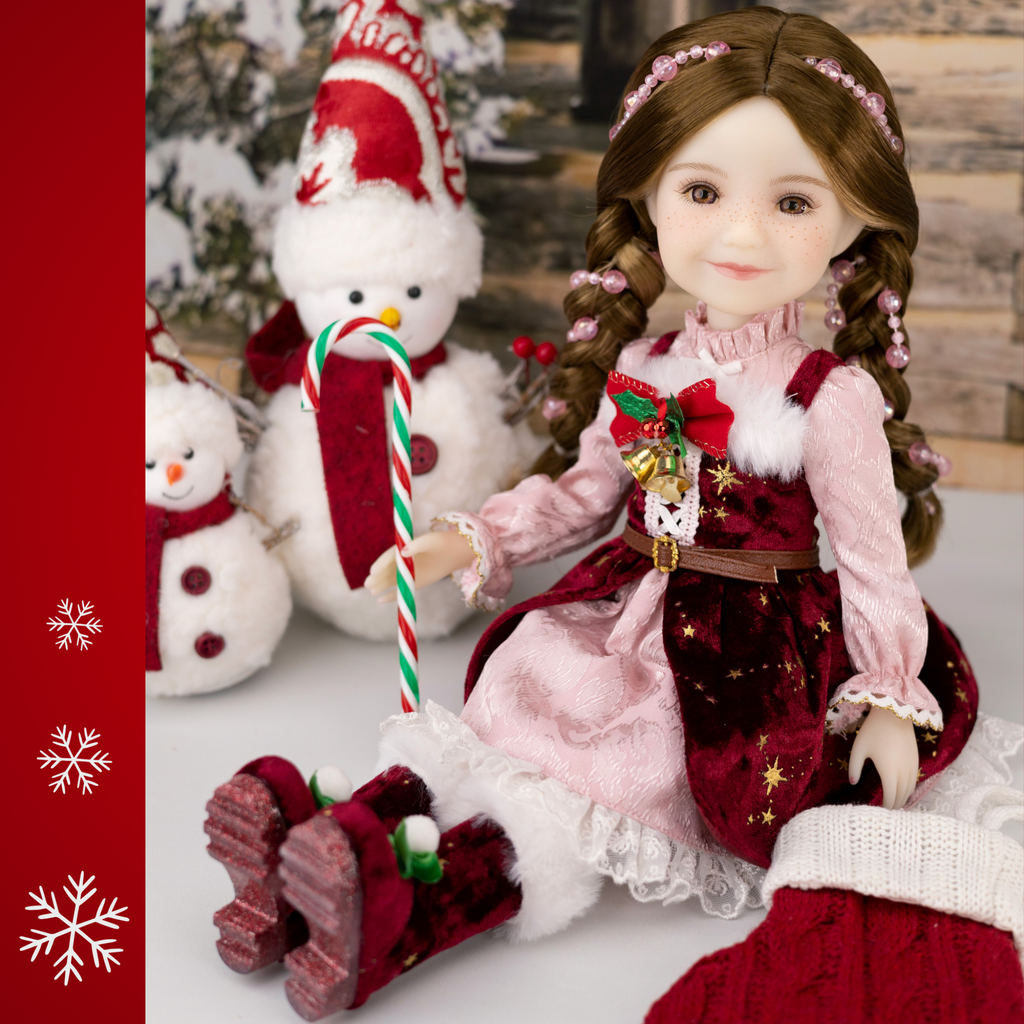Ruby Red 2025 Holiday Edition Doll Angel in red and pink Christmas themed dress.