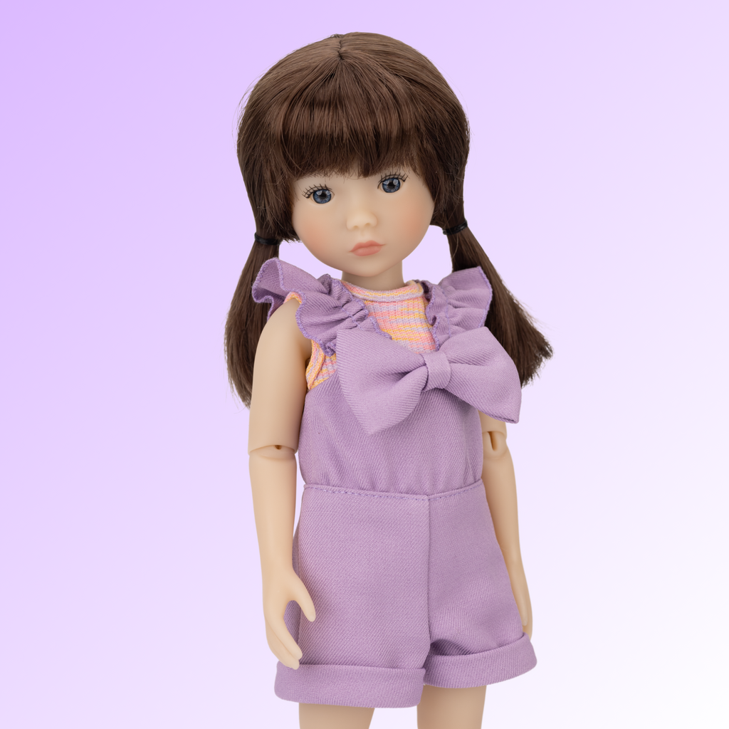 New Ruby Red doll named Tracy wearing a purple outfit.