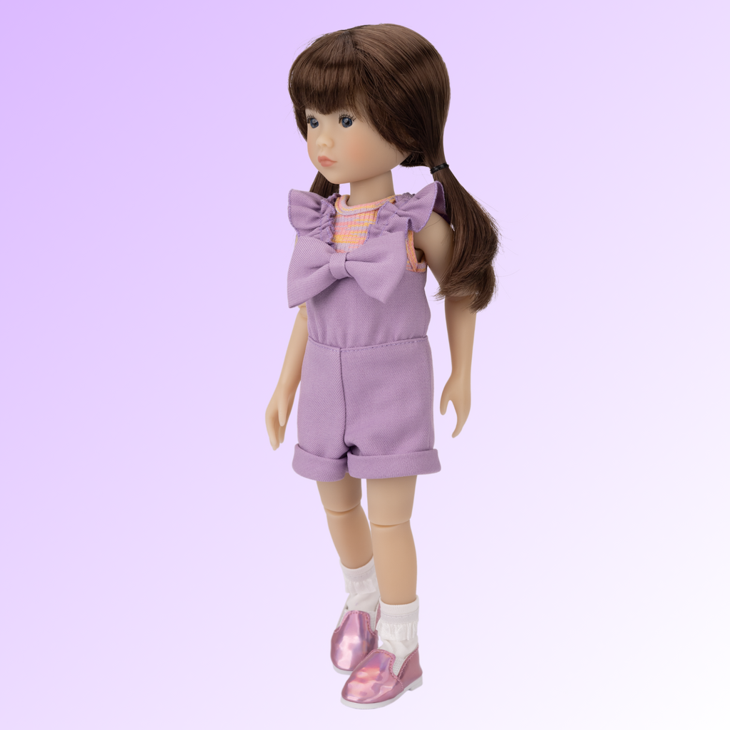 New Ruby Red doll named Tracy wearing a purple outfit.