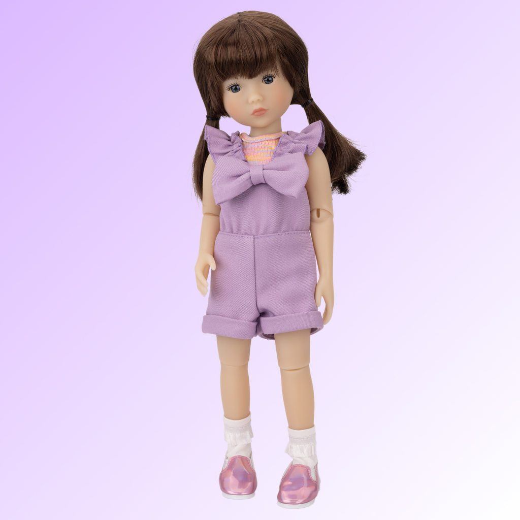 New Ruby Red doll named Tracy wearing a purple outfit.