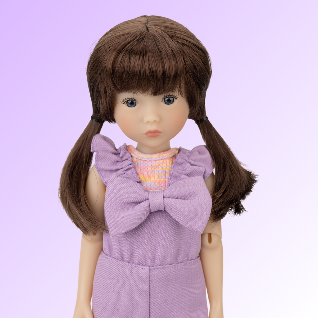 New Ruby Red doll named Tracy wearing a purple outfit.