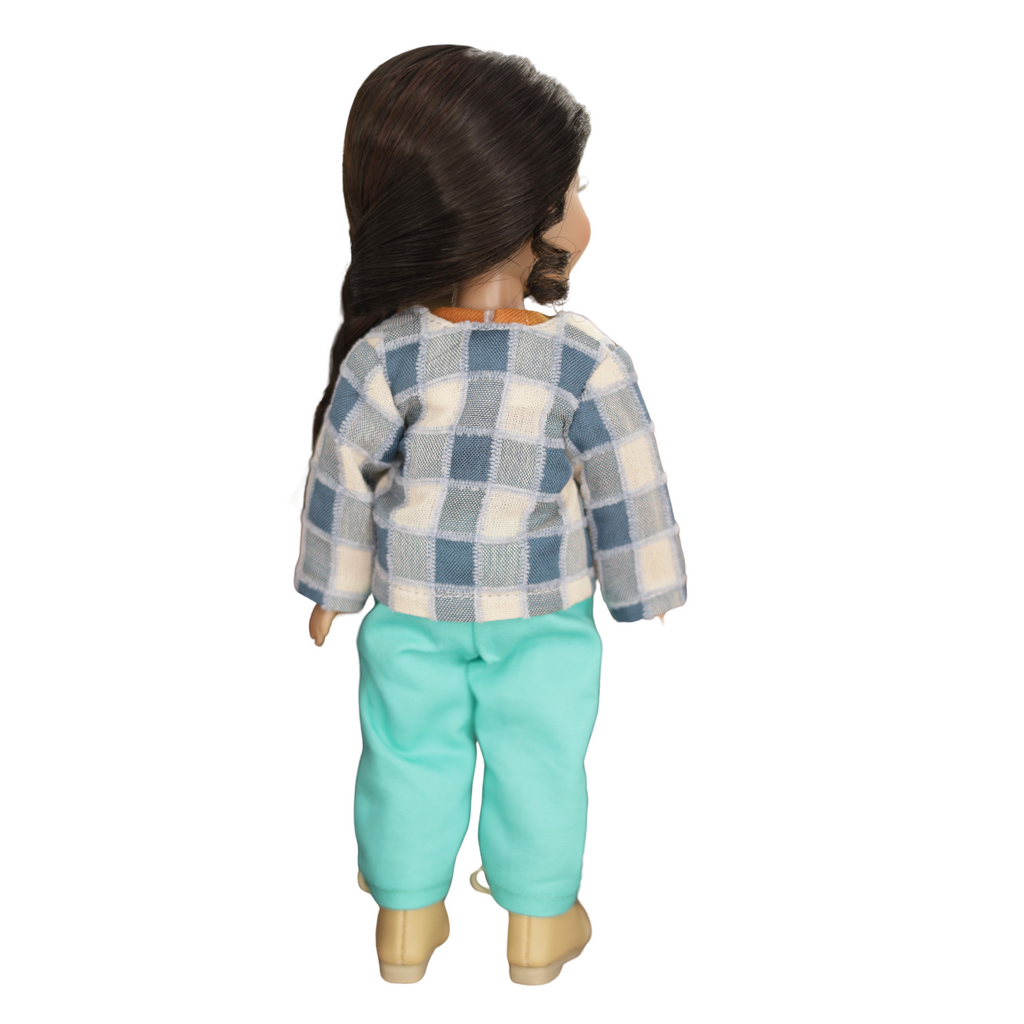 Doll wearing a checkered shirt and turquoise pants.